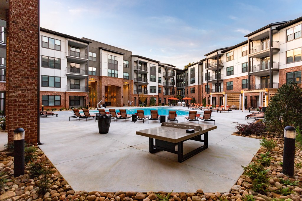 ping pong table with pool in background